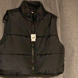 A black puffer vest